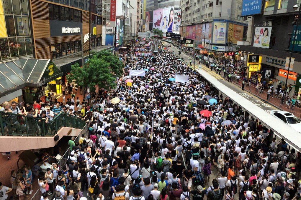 Record number of protesters stream down Hennessy Road. Photo: Jason Y Ng