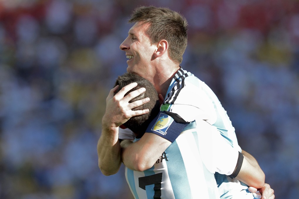 Lionel Messi celebrates with goalscorer Angel di Maria. Photo: AP