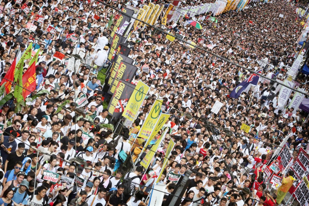 Protesters gather in a mass of colour in Causeway Bay - many spent hours queuing in Victoria Park and by 9.30pm, the march still stretched back to Wan Chai. Photo: Felix Wong