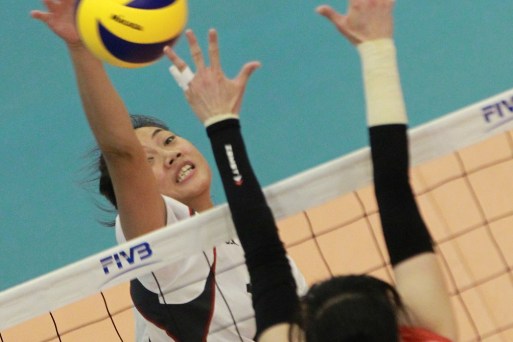 Hong Kong's Helen Ip Hoi-lun tries to beat South Korea's Lee Hyun-jeen to the ball during their group A game last night at Ma On Shan Sports Centre. Photo: Dickson Lee