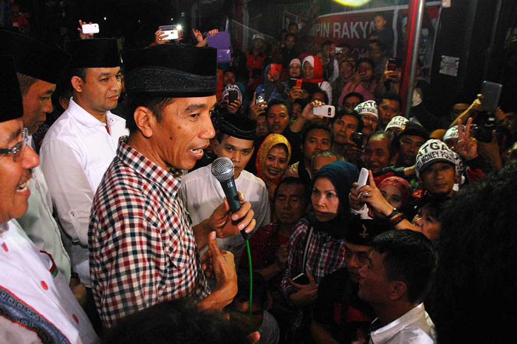 Indonesian presidential candidate Joko Widodo speaks to supporters as he campaigns in Batujajar, West Java on Wednesday. Photo: AFP