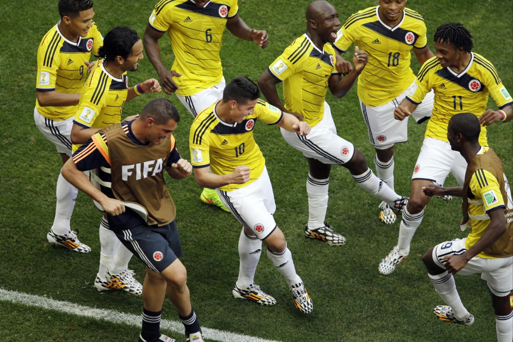 Colombia's James Rodriguez (centre) dances with teammates after scoring during their group C match against Ivory Coast. Photo: AP