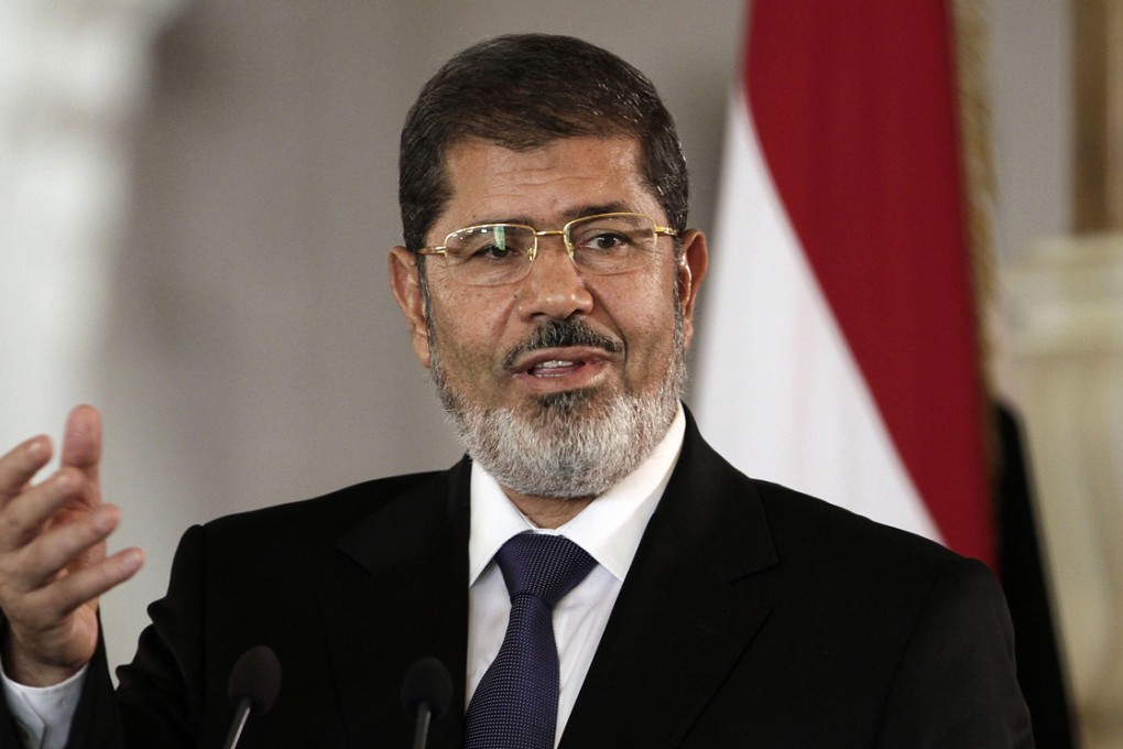 Egyptian President Mohammed Morsi speaks to reporters at the Presidential palace in Cairo. Photo: AP