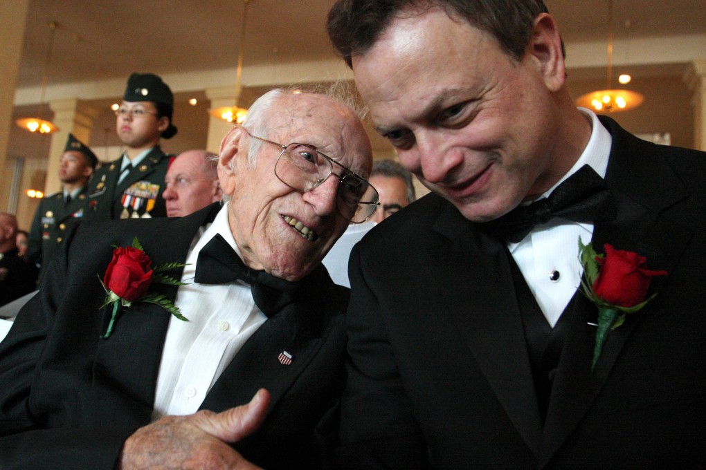 Louis Zamperini (left) has a chat with actor Gary Sinise. Photo: AP