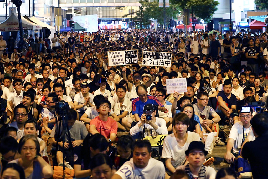 Protesters sit in after July 1 rally at Chater Road in Central. Photo: Nora Tam