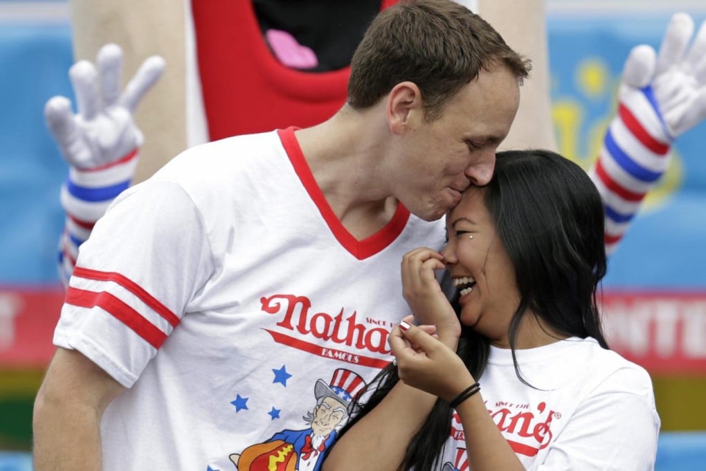 Joey Chestnut asks Neslie Ricasa to be his bride. Photo: EPA