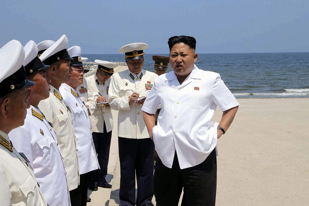 Kim speaks to navy commanders ahead of a swimming drill at an undisclosed location in North Korea. Photo: EPA