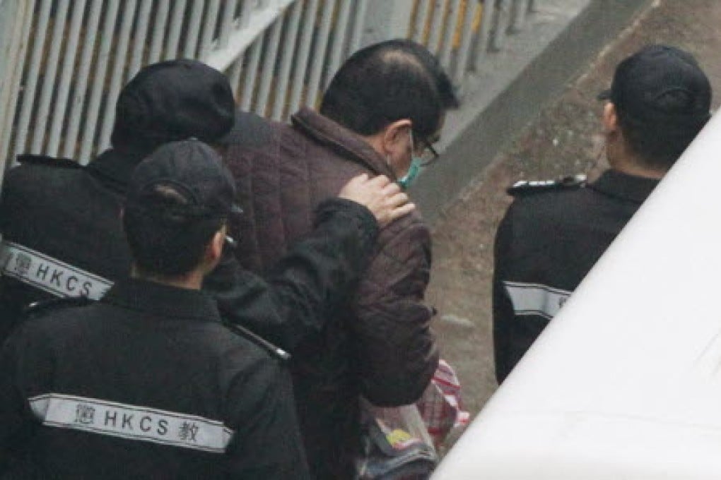 Carson Yeung Ka-sing, businessman and former chairman of the Birmingham City Football Club was led out by Correctional Services officers at the Lai Chi Kok Correctional Institution officers. Photo: Felix Wong