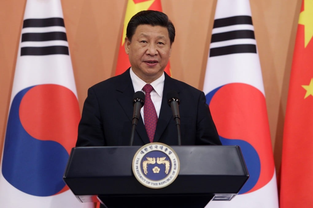 Chinese President Xi Jinping smiles during a meeting in South Korea. Photo: AFP
