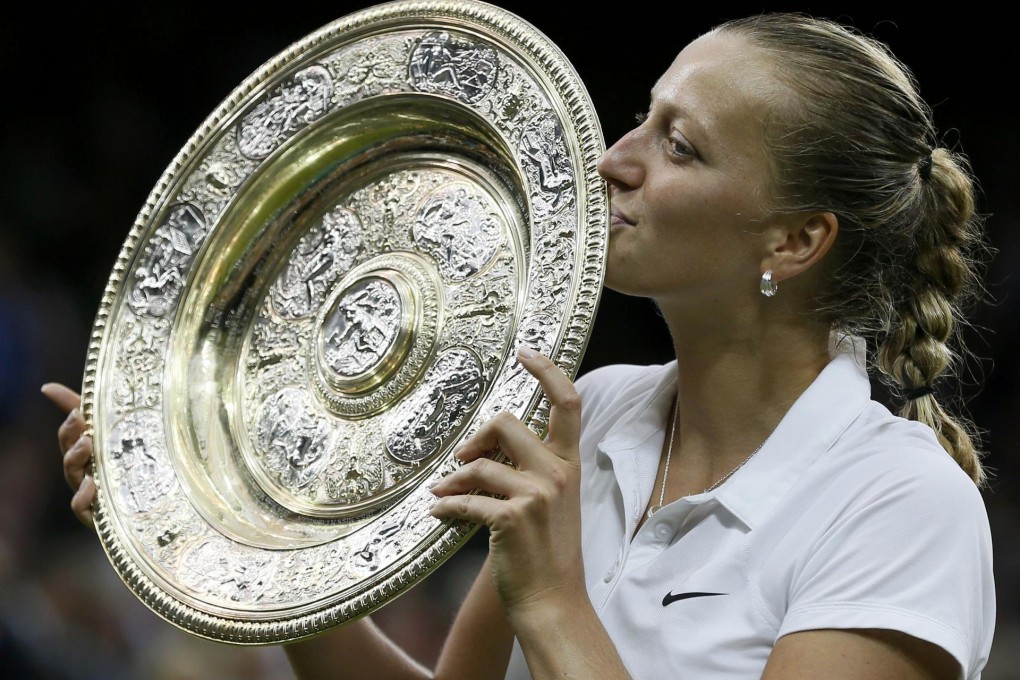 Petra Kvitova holds the Venus Rosewater Dish after beating Eugenie Bouchard in the women's singles final at Wimbledon. Photo: Reuters