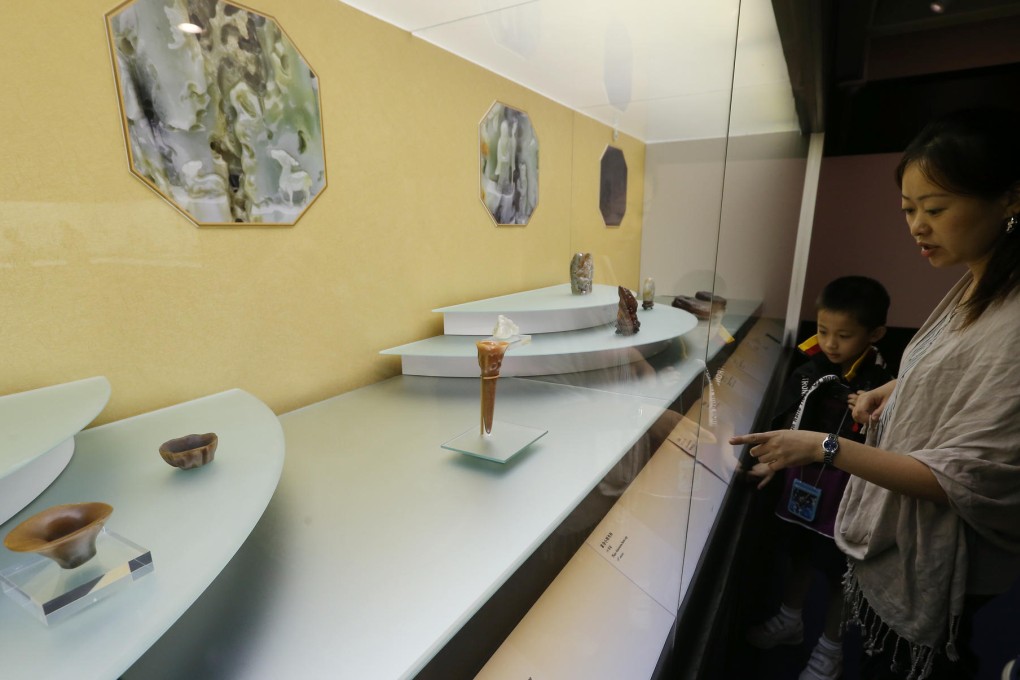 The exhibit includes ivory cups and carvings. Photo K.Y. Cheng