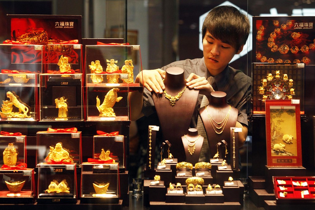 Gold prices will average US$1,250 an ounce in the third quarter, about 5.4 per cent less than now, according to the median of 15 estimates. Photo: Reuters