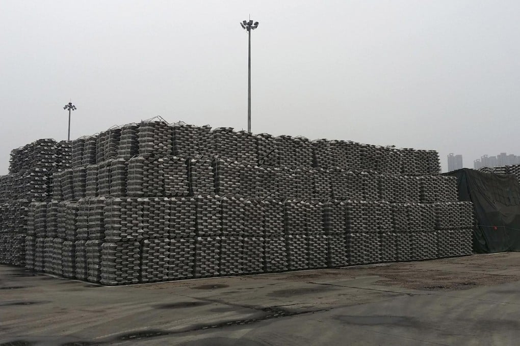 Aluminium ingots piled up at a storage area at Qingdao port.