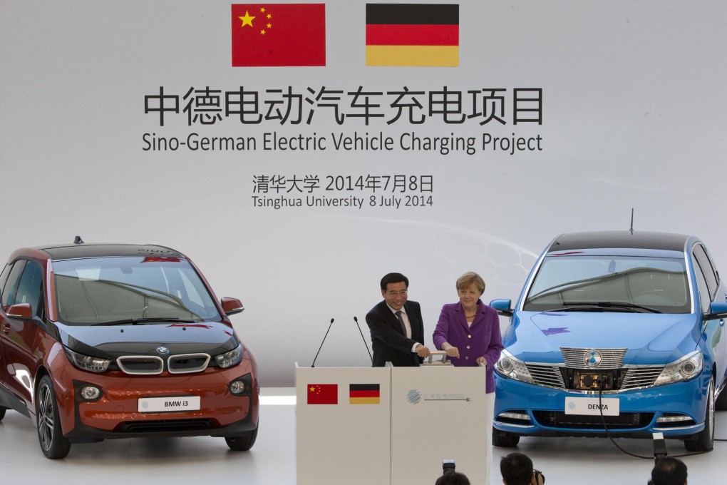Angela Merkel with Minister for Industry and Information Technology Miao Wei during a ceremony at Tsinghua University. Photo: AP