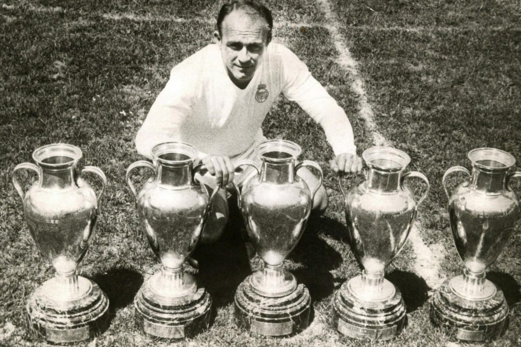 Alfredo Di Stefano poses in May 1960 with four of the five European Cup trophies Real Madrid won in consecutive years. Photo: EPA