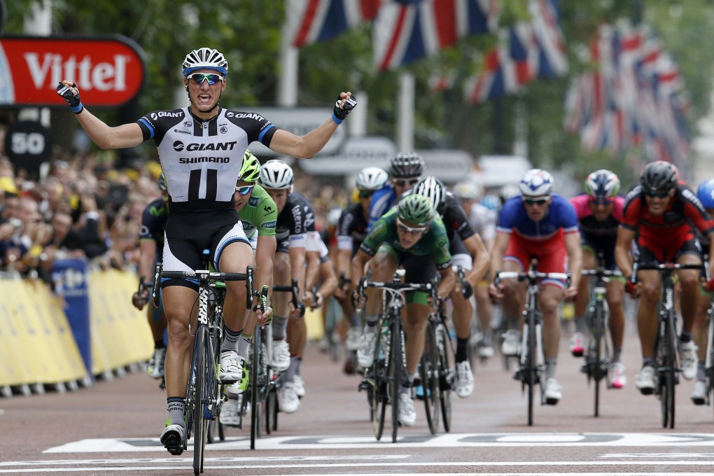 Marcel Kittel of Germany celebrates as he crosses the finish line to win the third stage of the Tour de France between Cambridge and London. Photo: EPA