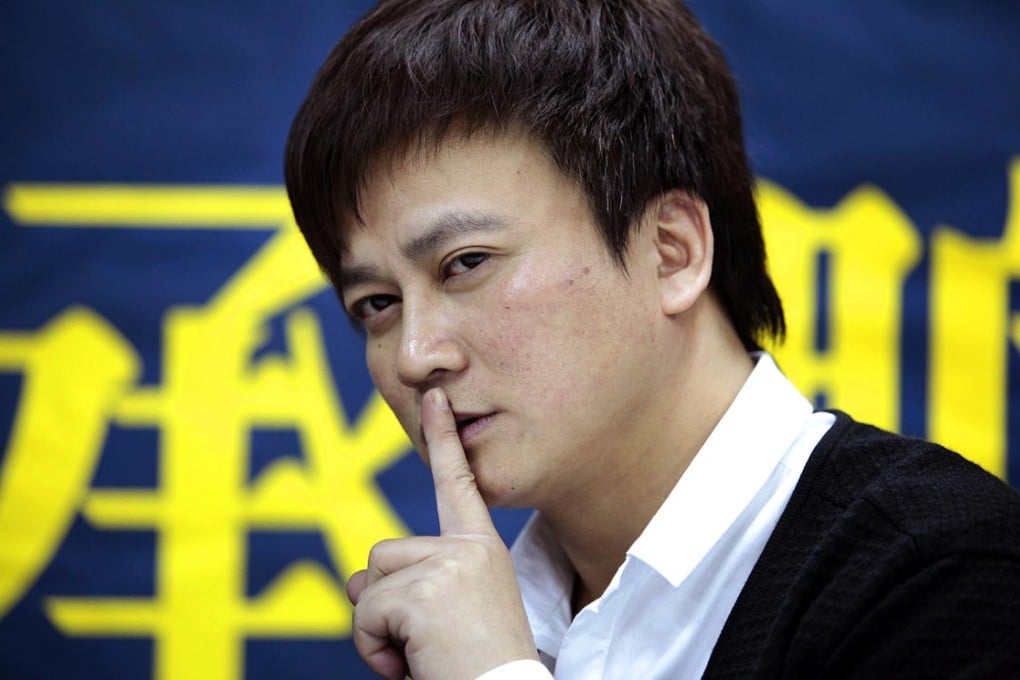 Li Chengpeng, a former football journalist and now a prominent liberal writer, gestures at the book signing ceremony in Beijing in January last year. Photo: Imaginechina