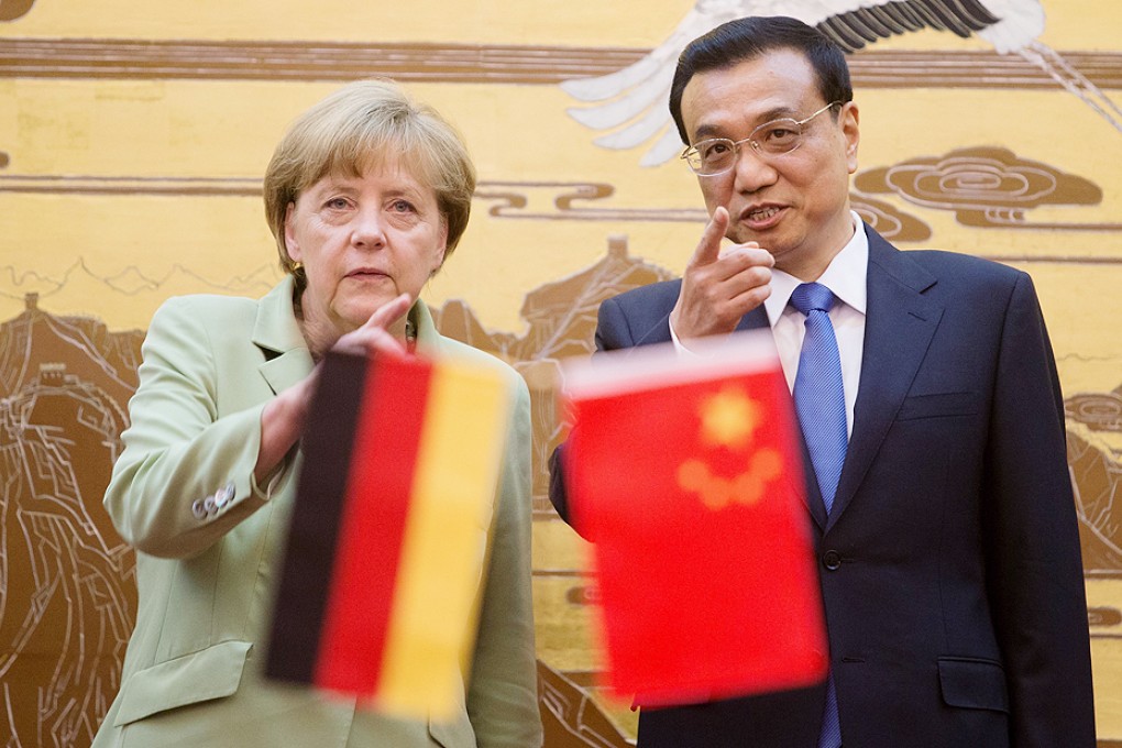 Angela Merkel chats with Li Keqiang during the signing ceremony at the Great Hall of the People in Beijing yesterday. Photo: Reuters