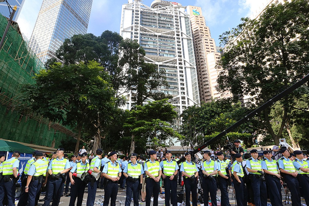 Police officers stand in Chater Road after the sit-in on July 2. Photo: David Wong