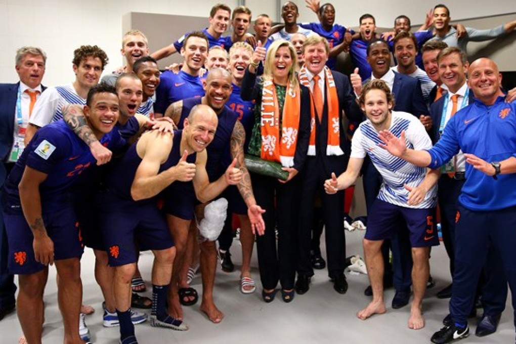 King Willem-Alexander and Queen Maxima visit the Dutch dressing room after their win over Spain. Photo: Fifa.com