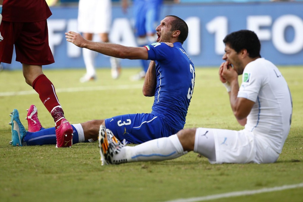 Luis Suarez (right) apologised a week after biting Italy defender Giorgio Chiellini in their match on June 24, but his actions were seemingly spurred by self-interest. Photo: Reuters