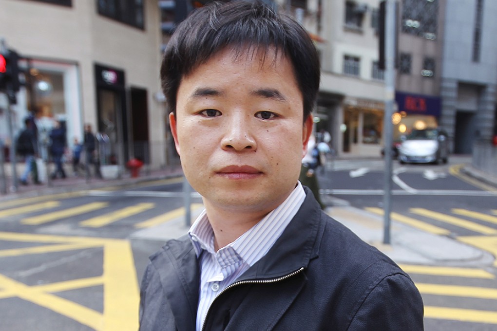 Hao Qun, a Beijing-based novelist, stands outside the Foreign Correspondents' Club in Central during a visit in 2011. Photo: Sam Tsang