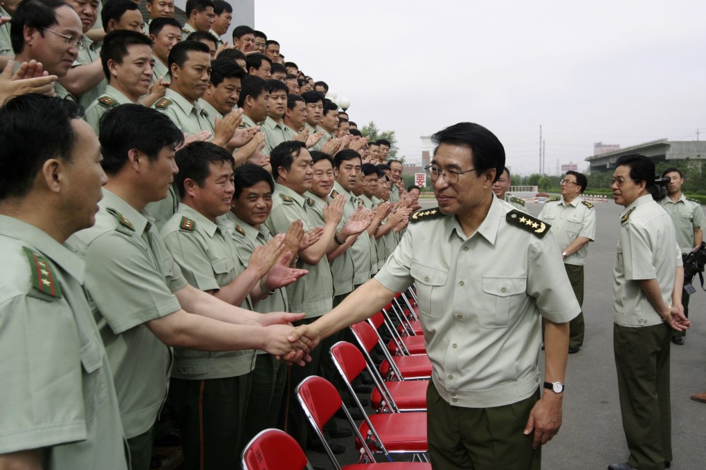 Xu Caihou shaking hands with Chinese officers in Changchun, Jilin, in this photo taken in 2004. Photo: Reuters