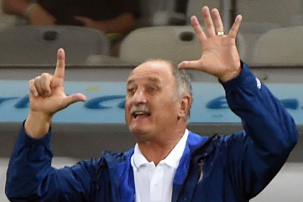 Scolari tells his players how many they need to pull back to take it to extra time. Photo: AFP