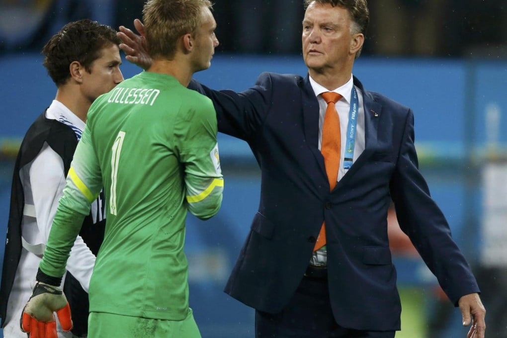 Louis van Gaal (right) consoles goalkeeper Jasper Cillessen. Photo: Reuters