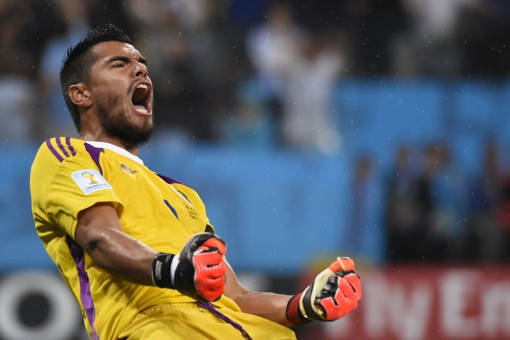 Argentina goalkeeper Sergio Romero celebrates after saving his second penalty. Photo: AFP