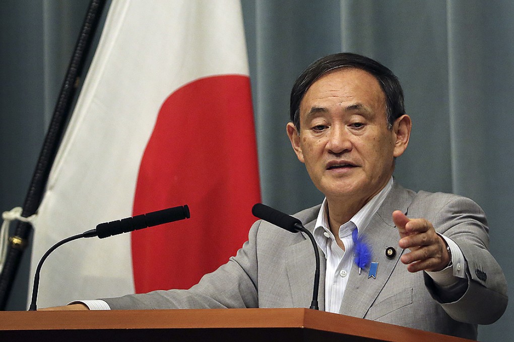 Japan's Chief Cabinet Secretary Yoshihide Suga denies press reportes taht North Korea has provided Tokyo with a list of abductees during a press conference in Tokyo on Friday. Photo: AP