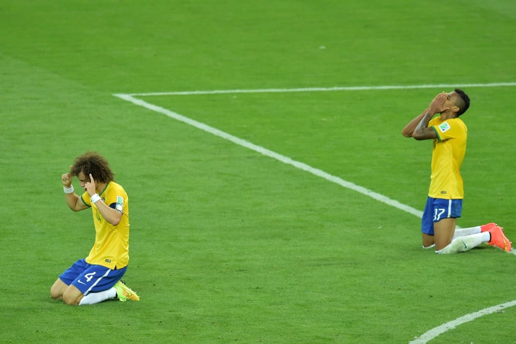 David Luiz and Luiz Gustavo collapse at the end. Photo: AFP