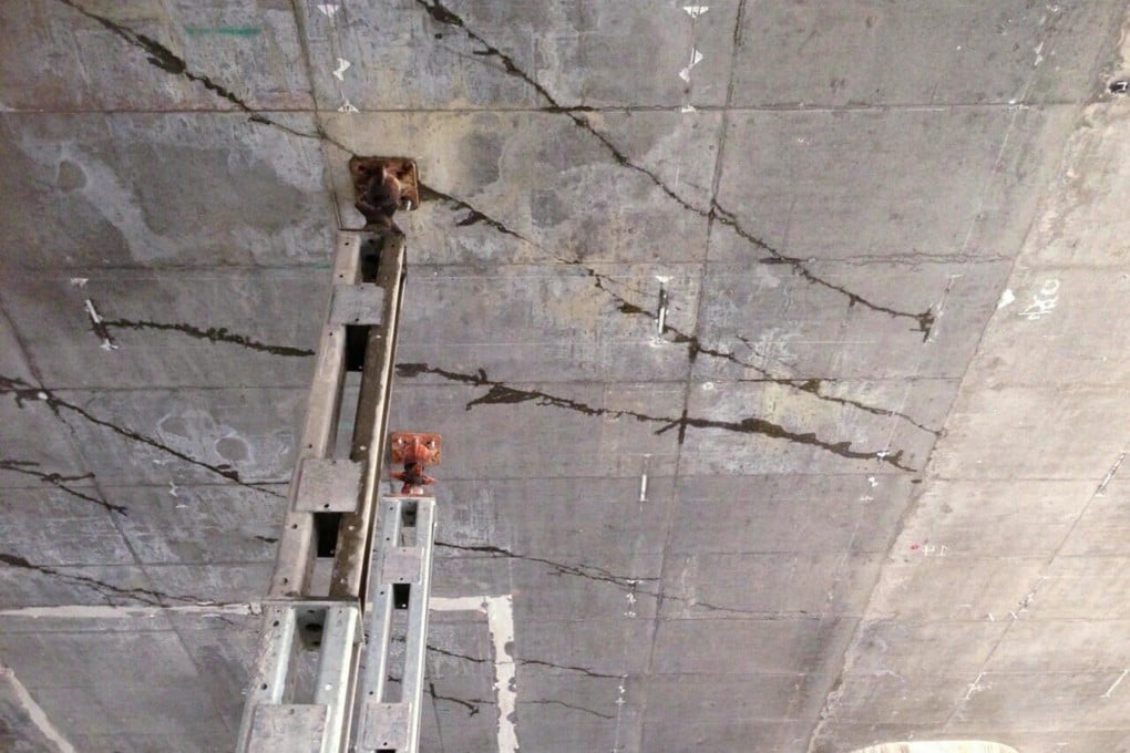 Cracks and supporting structures can clearly be seen on a ceiling at the West Kowloon rail terminus work site. Photo: SCMP