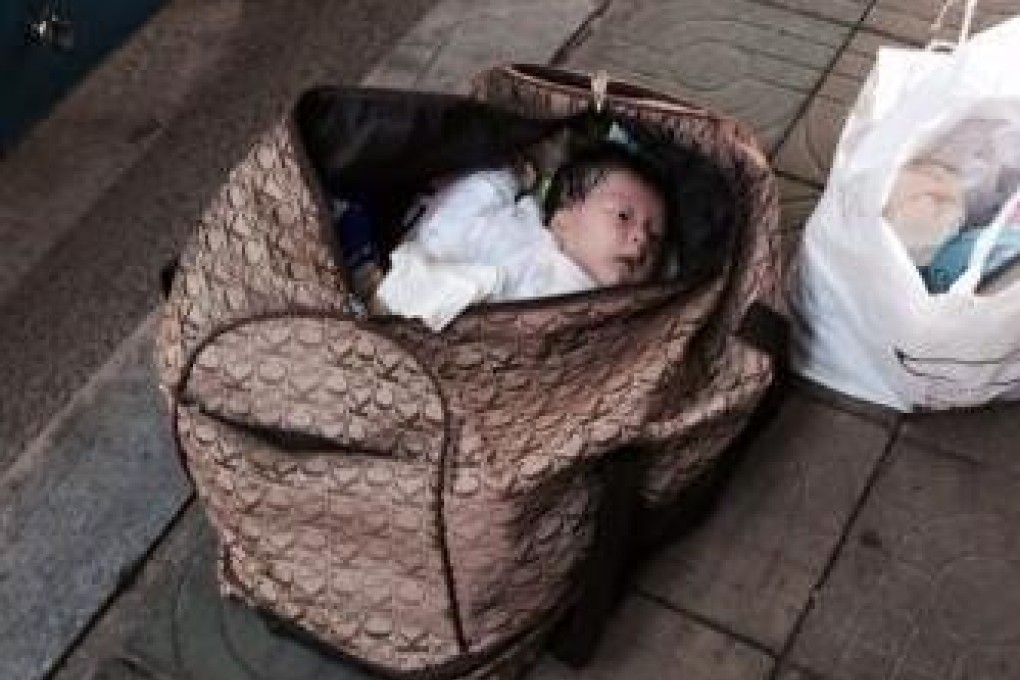 Passersby gave the baby water while waiting for emergency services and police to arrive. Photo: SCMP Pictures