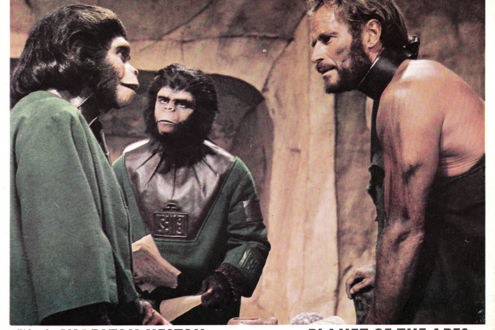 Charlton Heston as captured human Taylor with sympathetic chimpanzees Zira (Kim Hunter) and Cornelius (Roddy McDowall) from the original Planet of the Apes.