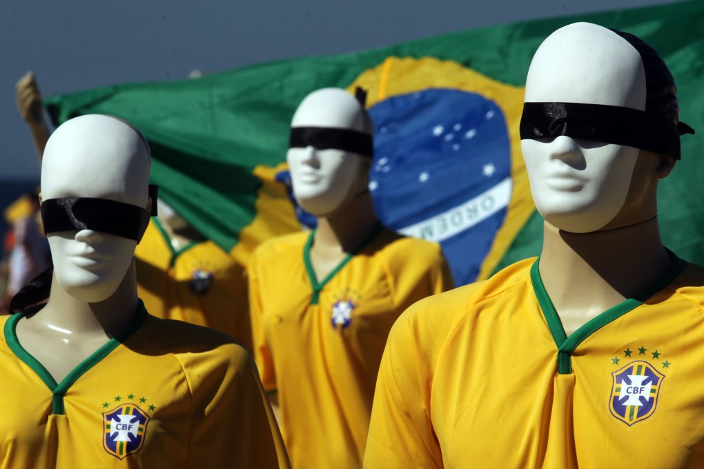 Mannequins with their eyes covered are seen during a protest against the high cost of the FIFA World Cup Brazil 2014 in Rio de Janeiro. Photo: Xinhua