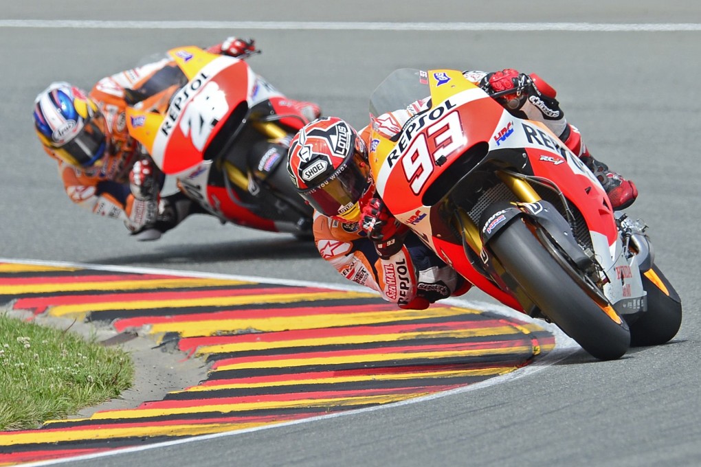 Honda rider Marc Marquez of Spain leads Honda rider Dani Pedrosa of Spain during the German Grand Prix at the Sachsenring circuit. Photo: AFP
