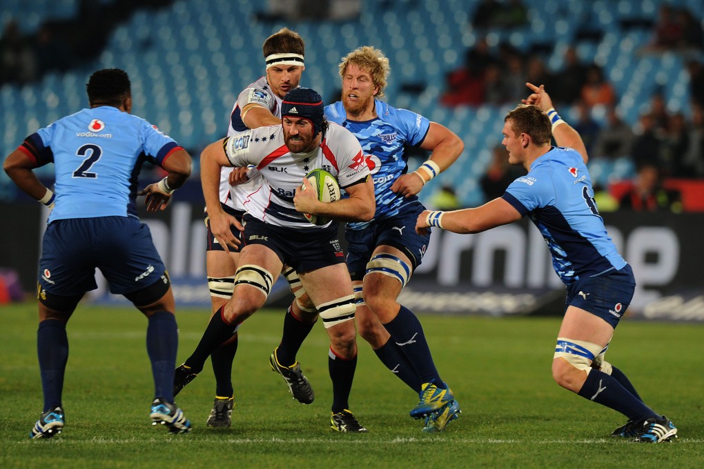 Caderyn Neville of the Melbourne Rebels tries to break through during their Super 15 match against the Bulls in Pretoria. The Bulls won 40-7. Photo: AFP