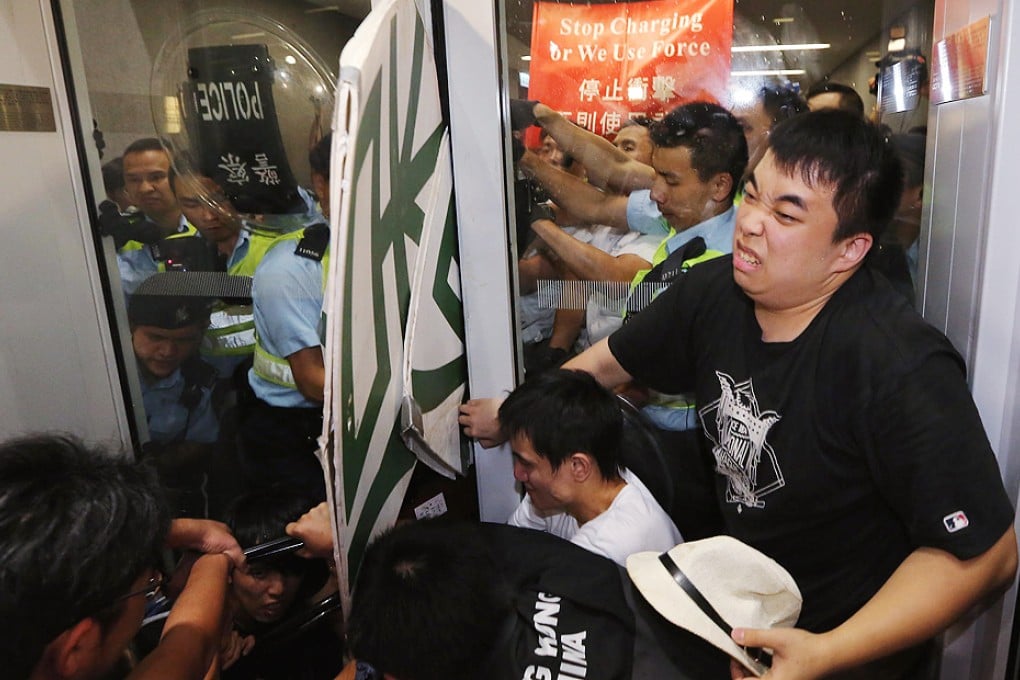Confrontation with the authorities is becoming more intense as in this clash with the police outside the Legislative Council complex last month. Photos: Felix Wong