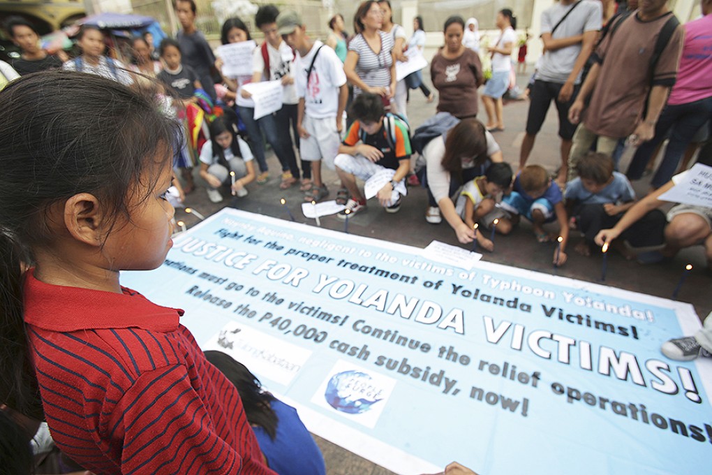 Protesters call for the continued aid for typhoon-ravaged Tacloban in Manila. The Philippines are bracing for first major storm of 2014. Photo: AP