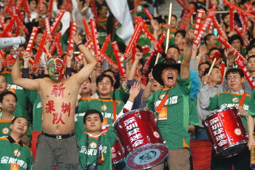 Let it never be said that Chinese people don't love soccer, as the fans of Shenzhen Jinwei football club show in 2006. Photo: EyePress