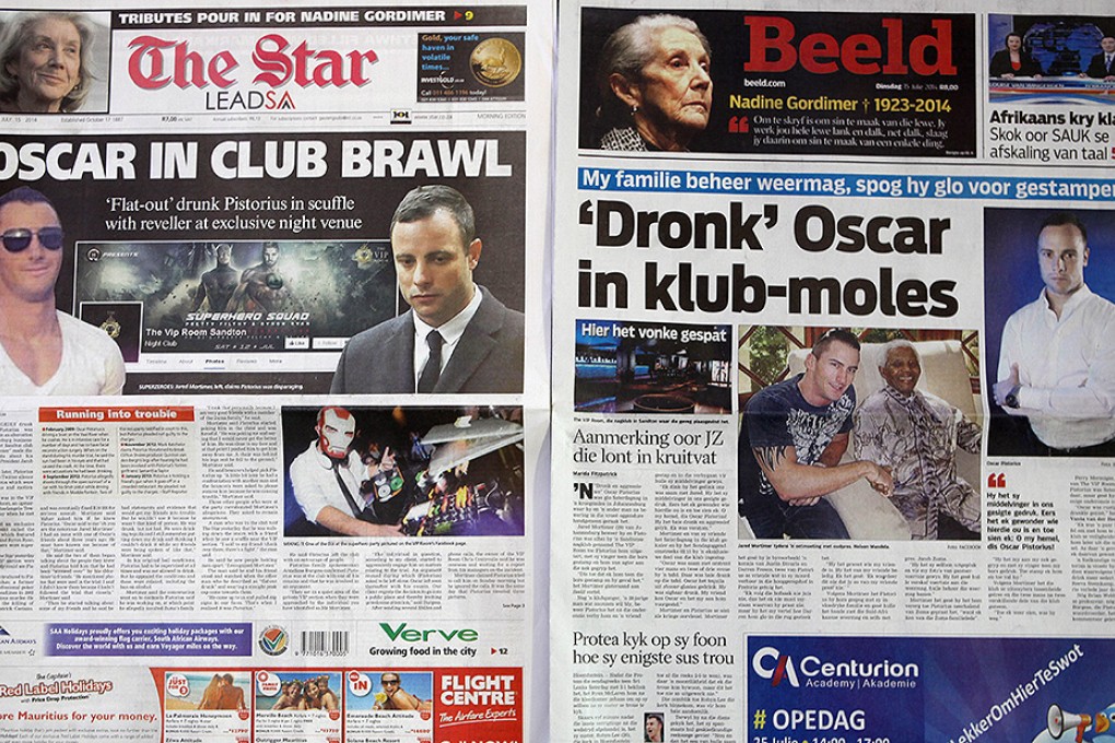 Two Johannesburg newspapers report on how Oscar Pistorius recently visited a nightclub with a cousin and was allegedly accosted by Jared Mortimer who aggressively questioned him about his murder trial. Photo: AP