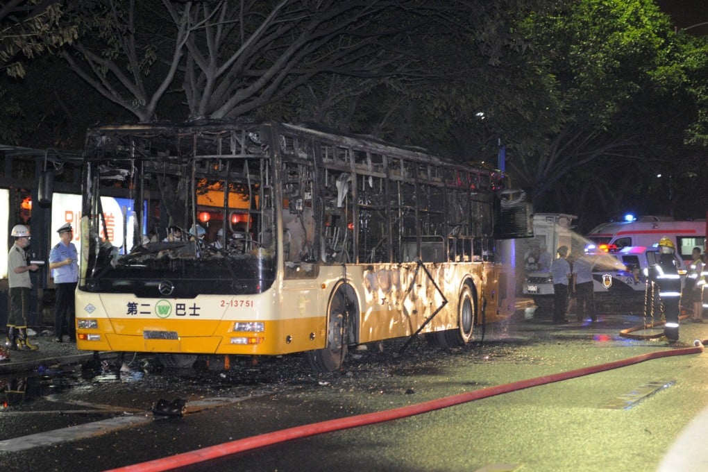 The bus after firefighters extinguished the blaze. The bodies of two people were found still in their seats. Eight people remain in critical condition. Photo: Xinhua