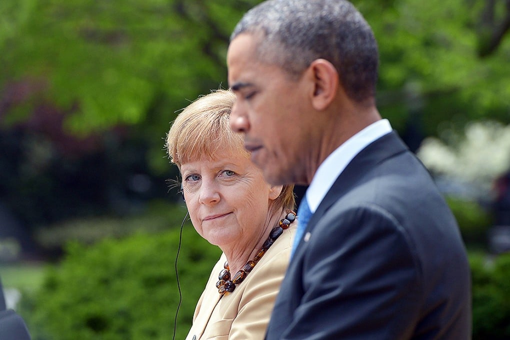 Barack Obama and Angela Merkel talk tough. Photo: AFP