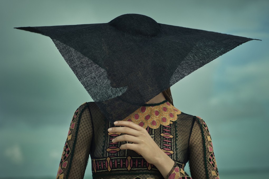 Embroidered lace dress (HK$53,500) by Valentino. Hat (HK$4,800) by Giorgio Armani.
