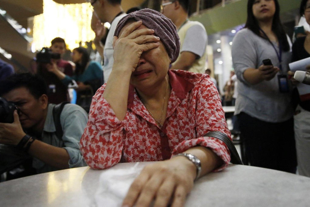 A woman who said her sister was on MH17 weeps at Kuala Lumpur Airport yesterday as she waits for information. Photo: Reuters