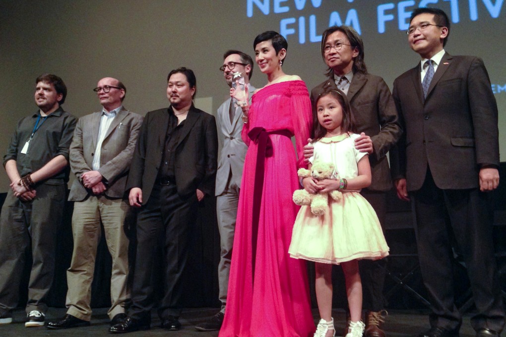 Sandra Ng, her partner, filmmaker Peter Chan, their daughter Jillian and NYAFF executive director Goran Topalovic (fifth from right). Photo: Paul Kazee