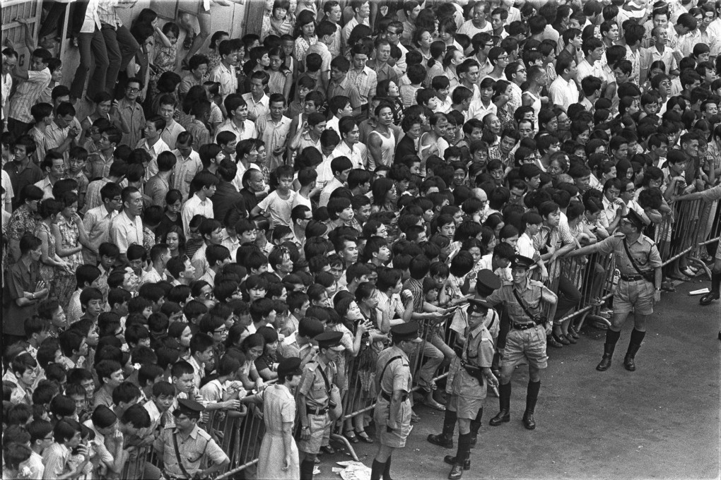 Police perform crowd-control duties as thousands turn out to pay their respects at Bruce Lee’s funeral on July 25, 1973. Photos: SCMP