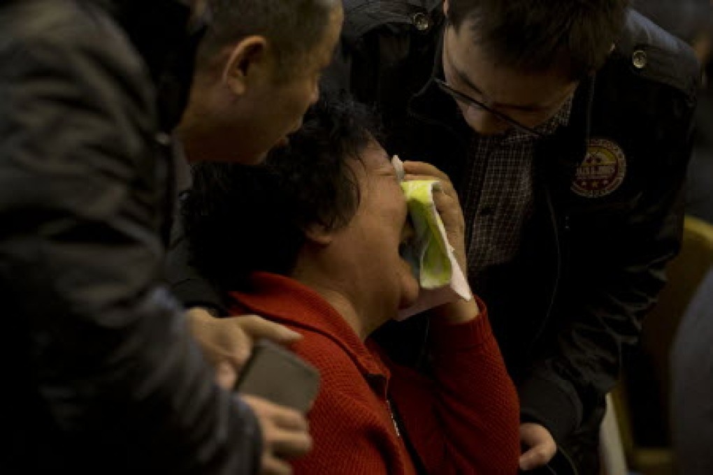 Relatives of Chinese passengers aboard Malaysia Airlines flight 370 want to comfort the families of passengers killed about MH17. Photo: AP