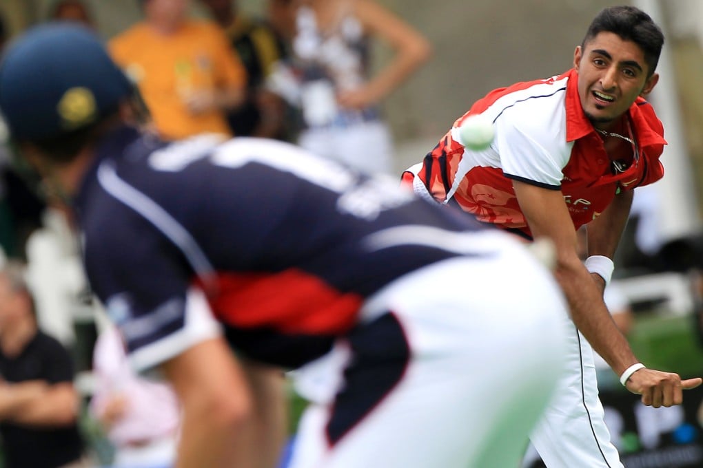 Hong Kong's Nizakat Khan bowls to England's Thomas Smith on the first day of the KARP Group Hong Kong Cricket Sixes in October 2012. Photo: Jonathan Wong